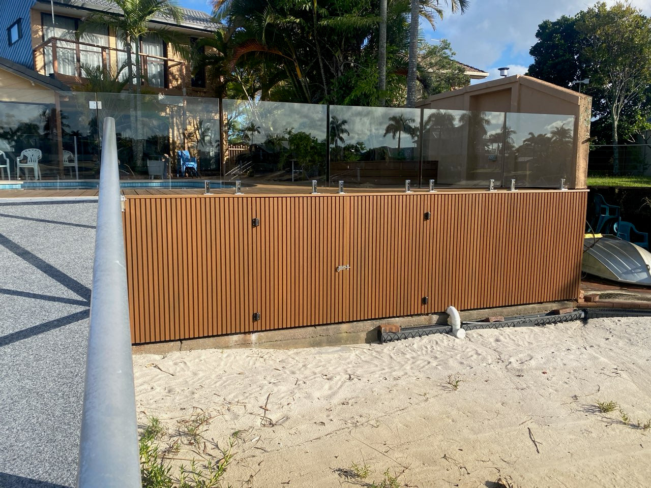 a jetty is clad in teak wpc wall panels.