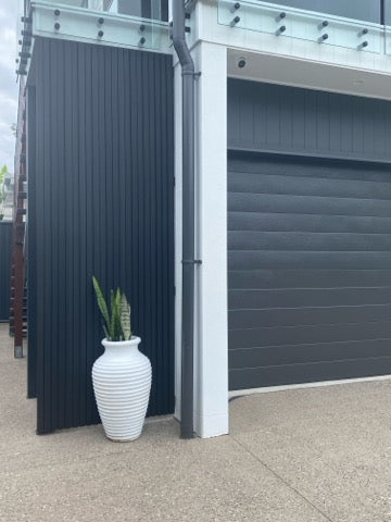 black cladding used in a garden to create a visual barrier.