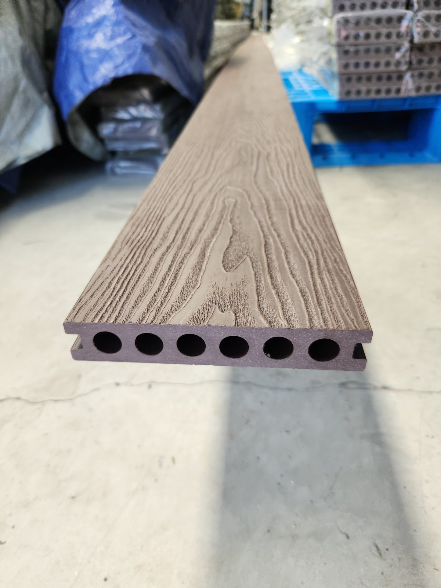 deck board close up, in the Bamboowearhouse Elevated composite deck with hidden fasteners, designed for strength and aesthetic appeal