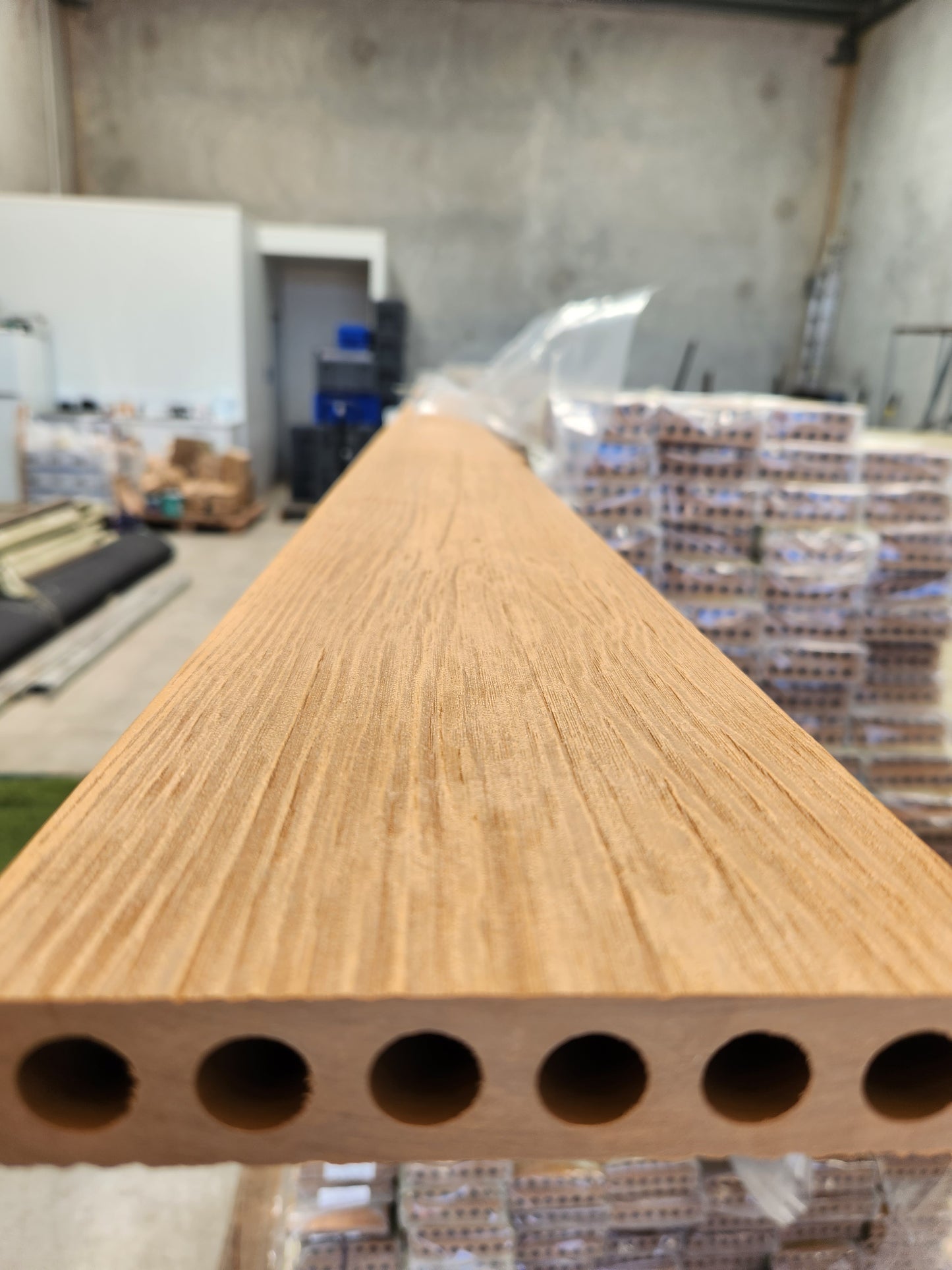 teak deck close up. Bamboo Wearhouse outlet.Wide composite decking boards with a textured surface, ideal for high-traffic outdoor spaces