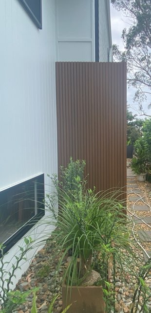 teak wpc used as a feature in a garden.