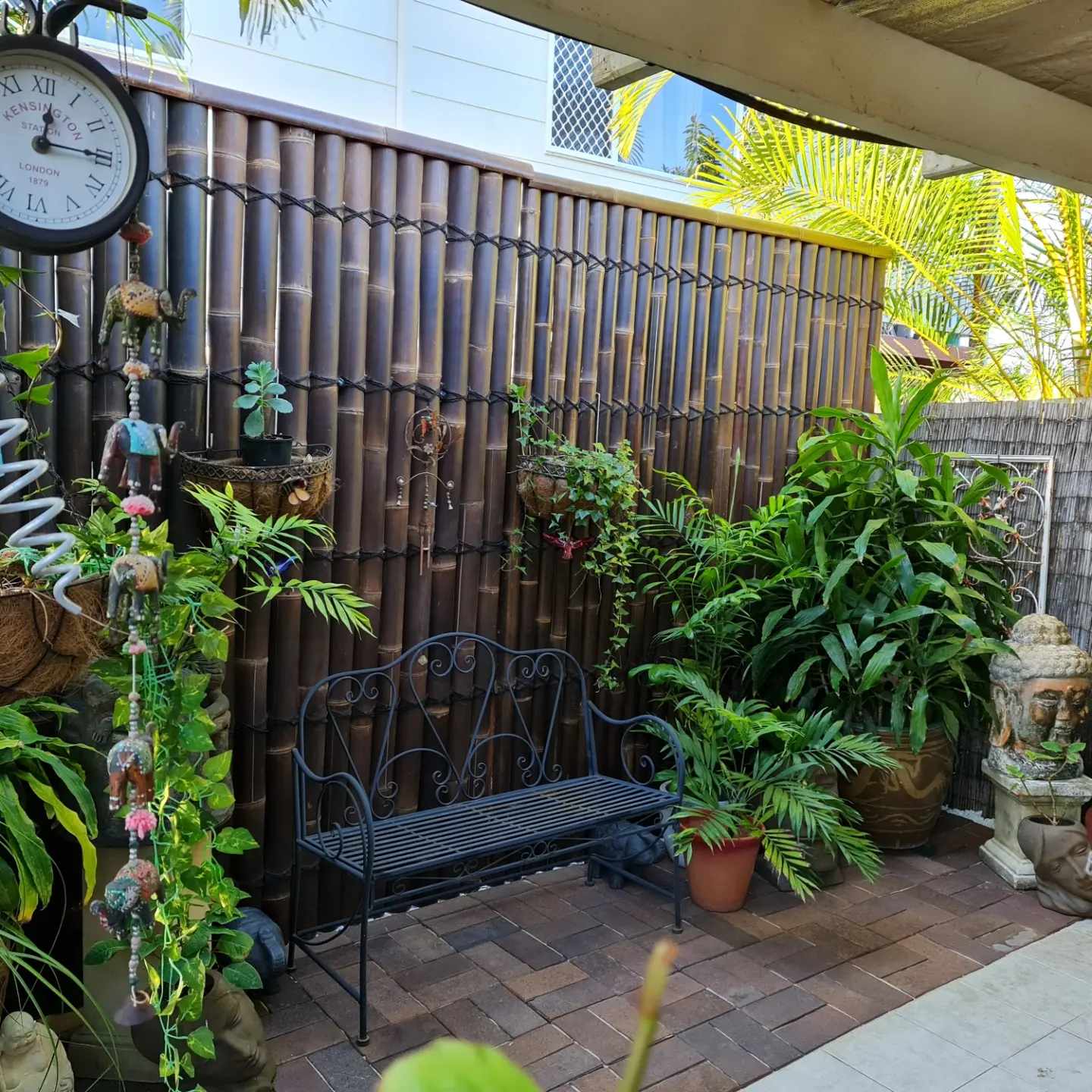 a terrace patio has become a zen retreat with bamboo panels.