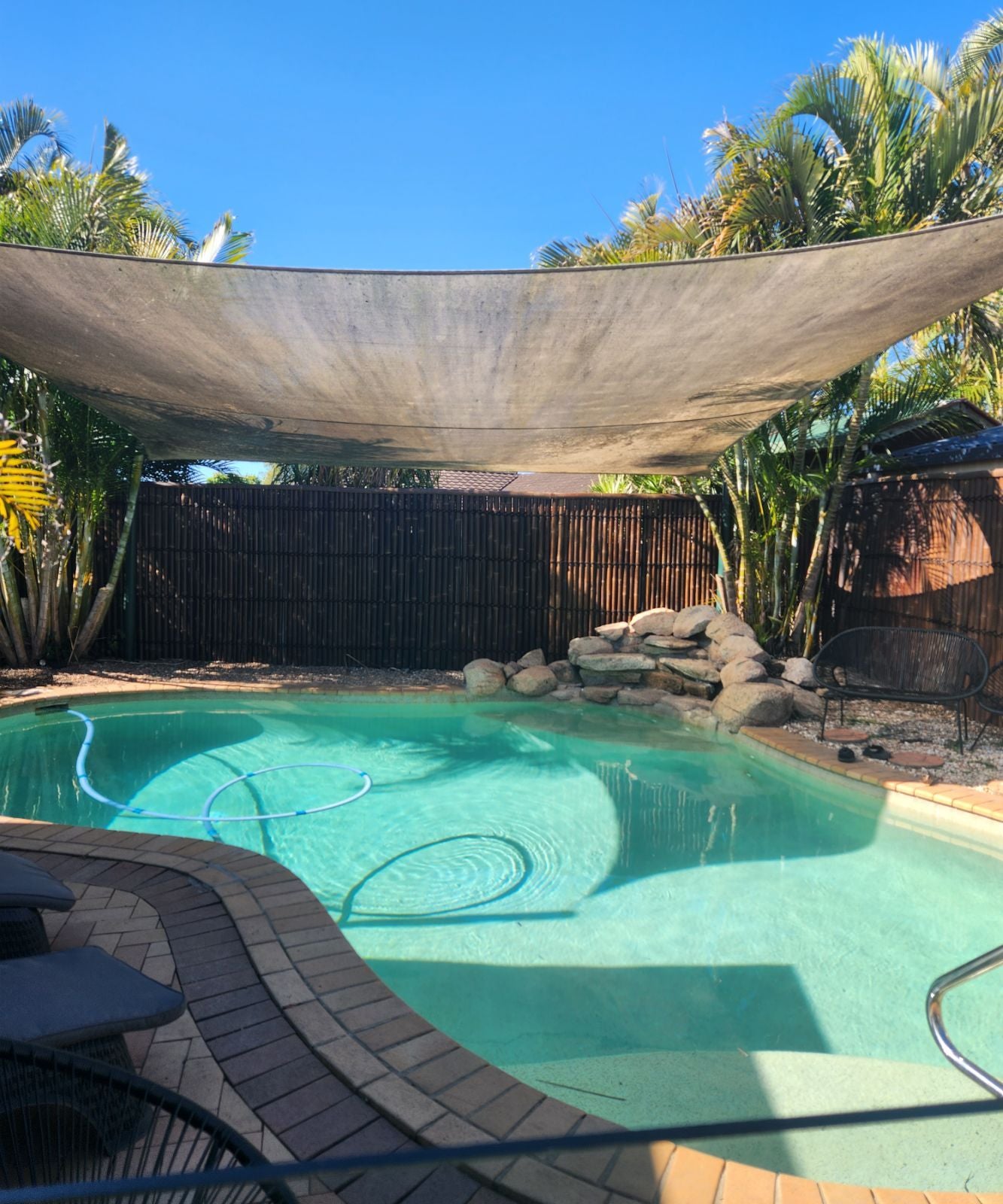 bamboo is used as a pool fence upgrade, making a holiday feel at a great price, thanks to the bamboo warehouse,