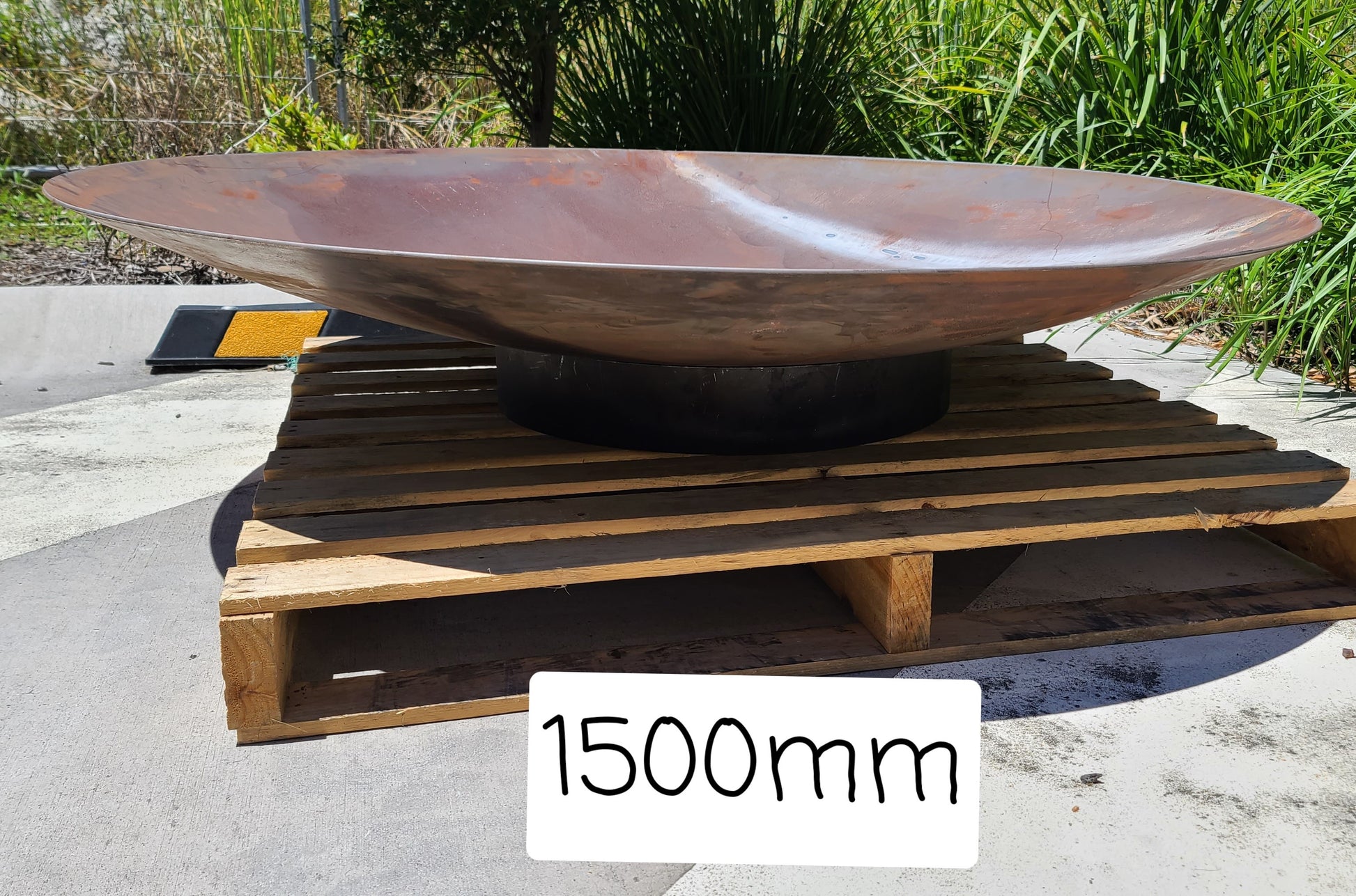 an 1500mm firepit from the bamboo Wearhouse, made from Corten steel.